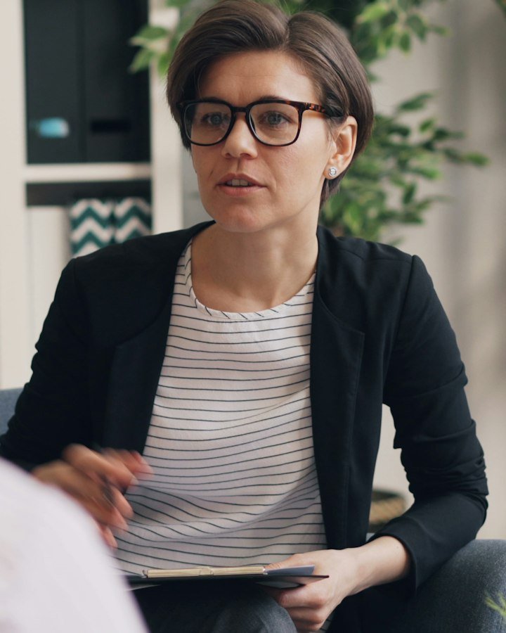 A counsellor listening and responding during a session